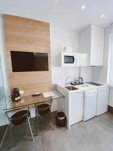 Una cocina o zona de cocina en Salamanca Suites Libertad
