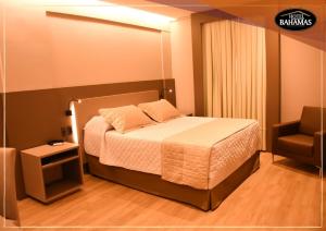 Cama ou camas em um quarto em Hotel Bahamas