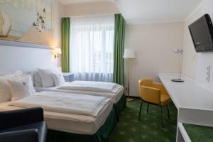 Postel nebo postele na pokoji v ubytování Hotel König Ludwig II