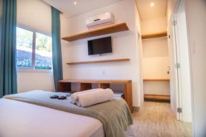 Katil atau katil-katil dalam bilik di Pousada Conca di Mare - Restaurante - Pé na areia com serviço de praia
