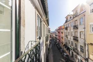 a view of a street from a balcony of a building at Lapa Elegant by Homing in Lisbon