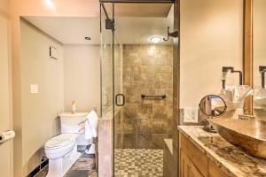 a bathroom with a shower and a toilet and a sink at Ski and Hike Mtn-View Condo in Silverthorne! in Silverthorne +18 photos