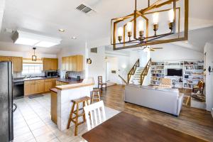 a large kitchen with a counter and a dining room at Guadalupe Oasis in Seguin