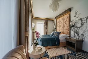 Postel nebo postele na pokoji v ubytování Serce Tatr Residence Zakopane - blisko Krupówek