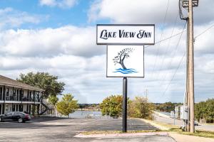 a sign for a lake view gym on a street at Lake View Inn in Granbury