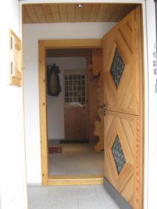 an open door into a room with a horse in it at Casa Zupada/Wegmüller in Lenzerheide