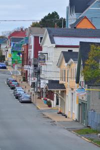 a small town with cars parked on a street at Smugglers Cove Inn in Lunenburg