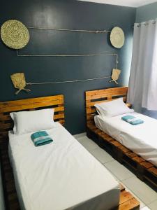 Uma cama ou camas num quarto em Aconchego na Capital do Forró - Térreo
