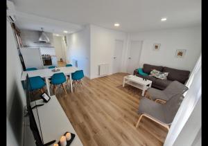 a living room with a couch and a table at Alojamientos Segóbriga Rural ( Mandil) in Segorbe