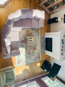 a room with a couch and a wall with a window at License to Chill in Holden Beach +25 photos