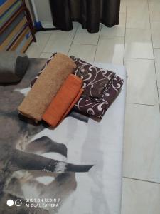 a brown towel sitting on top of a floor at Алексеевские акварели.. in Kharkiv