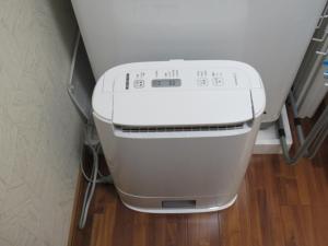 a white printer sitting in a corner of a room at Amami Lucky House - Vacation STAY 07619v in Amami