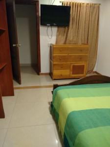 Postel nebo postele na pokoji v ubytování Hotel Ejecutivo Imperial