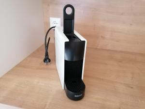 a black and white speaker sitting on a floor at BergAufe Chalets Mallnitz in Mallnitz