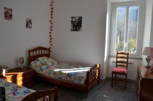 A bed or beds in a room at La maison d'Inca