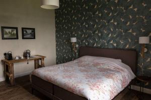 Un pat sau paturi într-o cameră la vakantiewoning maison doute
