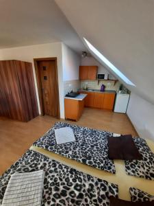 a room with a bed in the middle of a kitchen at Apartmany Star in Liptovský Mikuláš