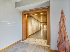 a hallway of a house with a door with a rug at Bluebird Suites at Reston Town Center in Reston