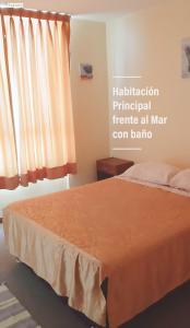 A bed or beds in a room at Frente al Mar Apartamento San Miguel LIMA CHECK IN