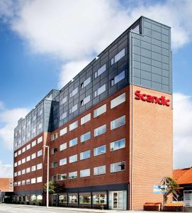 a building with a santander sign on the side of it at Scandic Olympic in Esbjerg