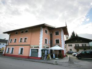 a large building on the side of a street at Apartment Uderns near Hochzillertal Ski Lift in Uderns