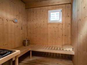 a sauna with a bench and a window at Wooden chalet in Stadl an der Mur with sauna in Stadl an der Mur