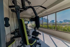 a gym with a view of the city at Suites Arquimedes 33 in Mexico City