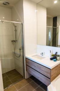 a bathroom with a sink and a shower at Hidden Valley Resort in Wallan