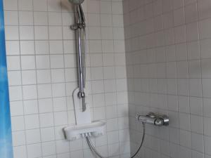 a bathroom with a shower with a sink at Gorgeous Bungalow in Pepelow near Sea Beach in Pepelow