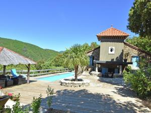 a villa with a swimming pool and a tower at Charming villa with private pool in Prémian