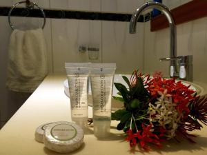 a bathroom with two tubes ofodorizers on a counter at Curacao Suites Hotel in Willemstad