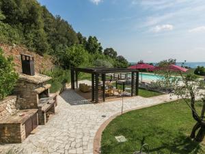 a garden with a pergola and a swimming pool at Farmhouse in Montoro near Montoro Castle in Narni
