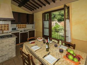 a kitchen with a table with fruit on it at Farmhouse in Montoro near Montoro Castle in Narni