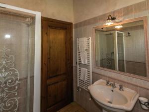 a bathroom with a sink and a mirror at Farmhouse in Montoro near Montoro Castle in Narni +32 photos