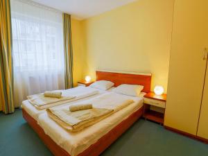 Postel nebo postele na pokoji v ubytování Comfortable Apartment in Miedzyzdroje near Beach