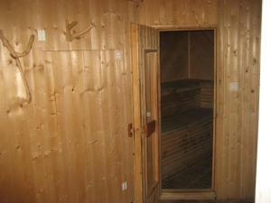 a wooden wall with a door in a room at Beautiful Holiday Home in Syssleb ck with Sauna in Sysslebäck