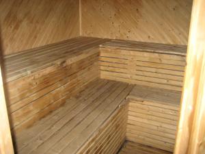 a wooden sauna is shown with a wooden floor at Beautiful Holiday Home in Syssleb ck with Sauna in Sysslebäck