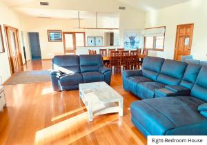 a living room filled with furniture and a couch at Pokolbin Village in Pokolbin