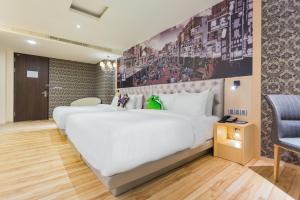 Letto o letti in una camera di FX Hotel Tainan