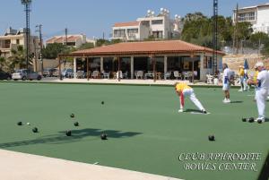a group of people playing bowls on a tennis court at Club Aphrodite in Erimi