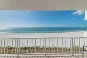 a view of the beach from a balcony at Admiralty House 1705S in Marco Island