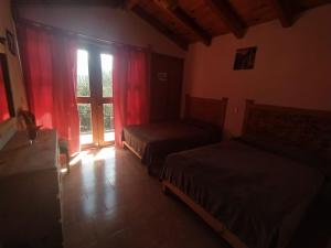 Letto o letti in una camera di Cabaña "La Matera"