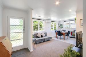 a living room with a couch and a table at Mama and Papa's - Havelock North Holiday Home in Havelock North