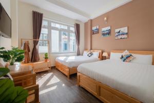 Postelja oz. postelje v sobi nastanitve Moc Thach Hostel Dalat