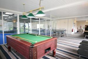 a pool table in the middle of a room at Pentire Newquay Cornwall Hotel in Newquay
