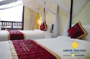 Voodi või voodid majutusasutuse Sài Gòn - Bản Giốc Resort toas