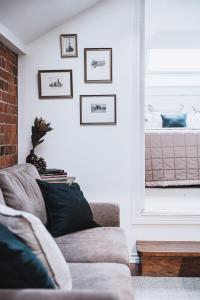 a living room with a couch and a bed at The Loft in Castlemaine