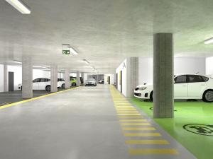 uma garagem de estacionamento com vários carros estacionados nela em Apartmany Arber em Železná Ruda