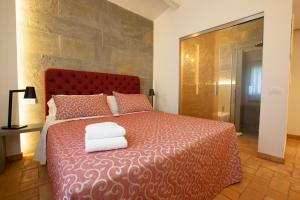 Posteľ alebo postele v izbe v ubytovaní Agriturismo Torre del Marino