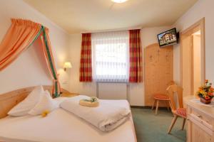 Postel nebo postele na pokoji v ubytování Hotel Theiner